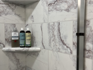 Classic bathroom, black and white shower shelves