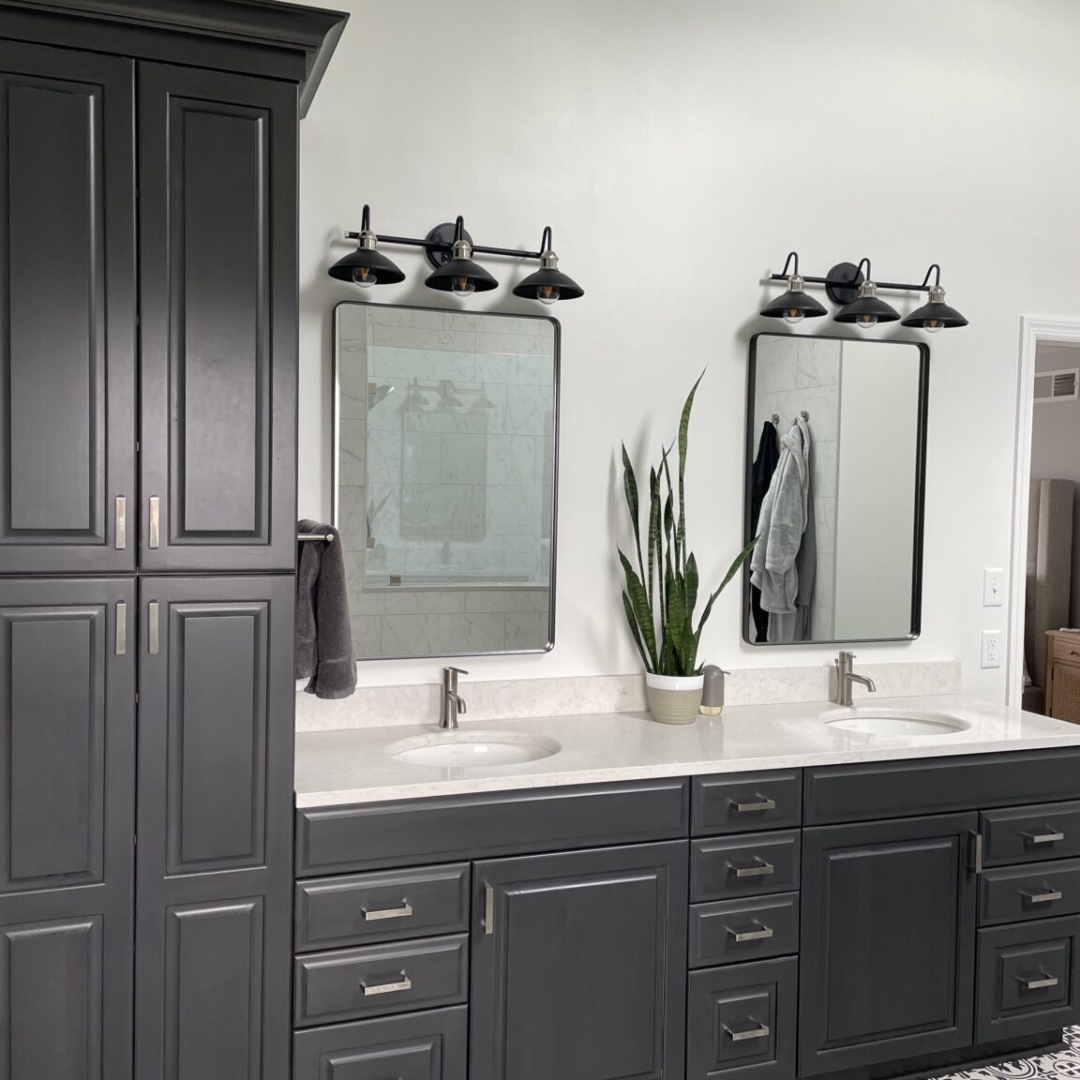 Contemporary bathroom, high linen closet, white marble countertop double sink, dark cabinet storage, traditional black and white floor tiles