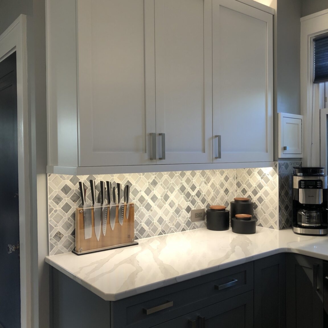 Classic kitchen, cabinet lights, marble white counter