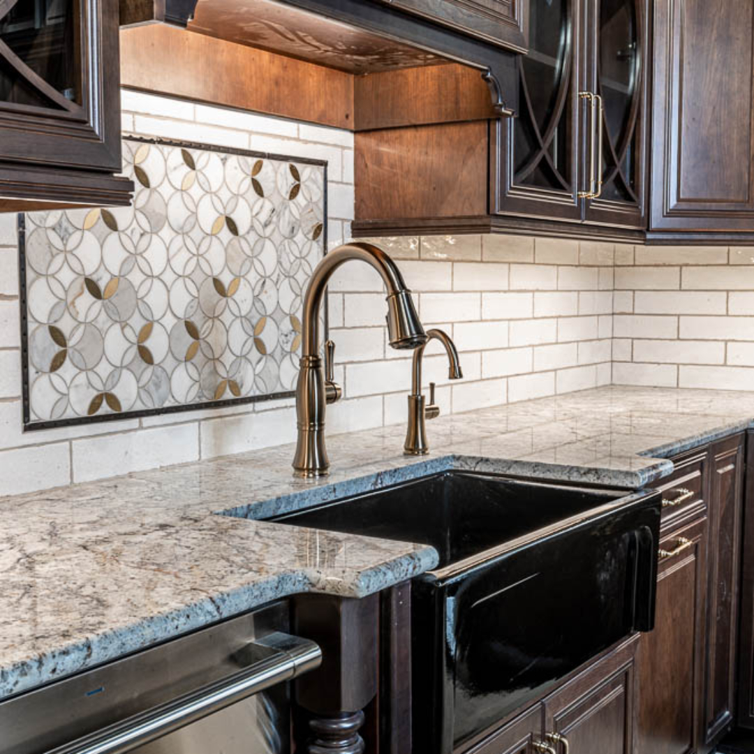 Traditional kitchen remodel, farming sink, white tile backsplash, traditional brown cabinets, marble counter