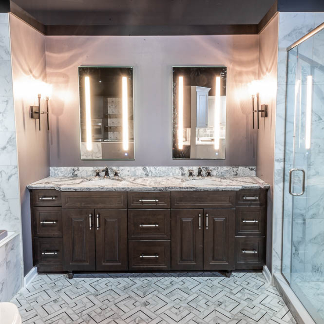 Classic bathroom, double sink with black and white marble top and dark cabinets, shower with large grey wall tiles, tub, modern black and white tile floor