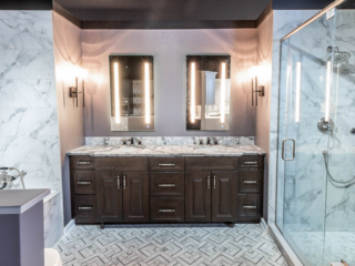 Classic bathroom, double sink with black and white marble top and dark cabinets, shower with large grey wall tiles, tub, modern black and white tile floor