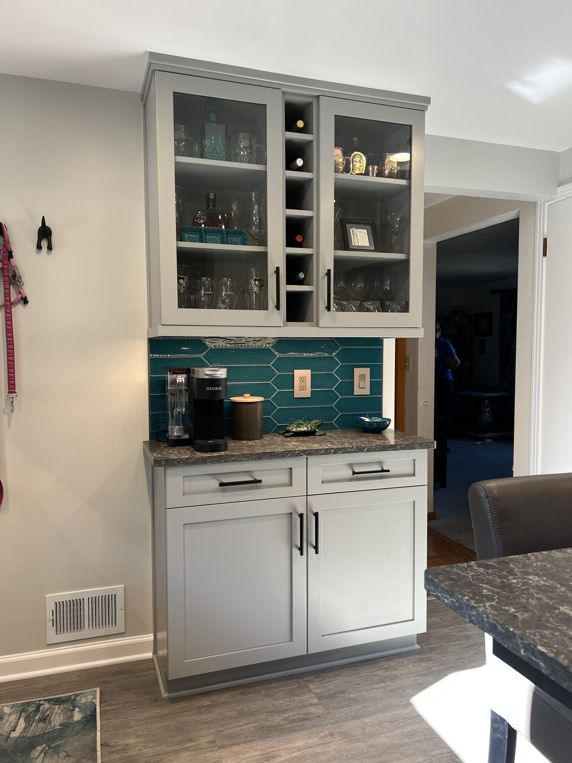 Classic kitchen remodel, blue teal tile, light grey closets with glass doors and wine bottle storage, butlers pantry
