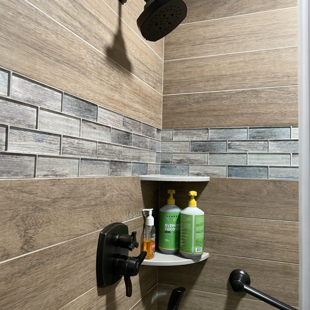 Contemporary bathroom, wood tile shower, classic white shelves, black shower head
