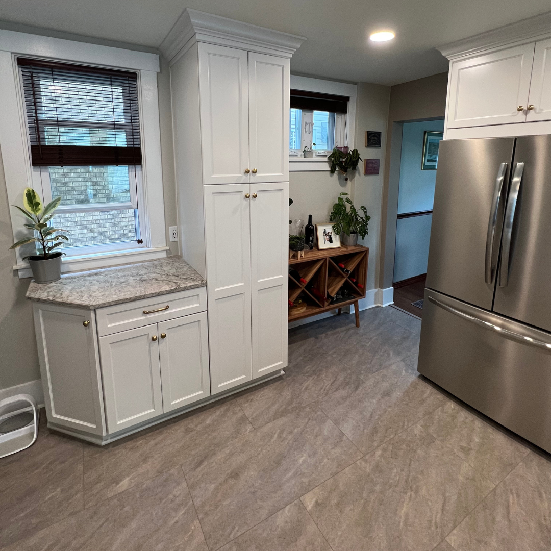 Classic kitchen remodel, marble countertop, white cabinets and storage
