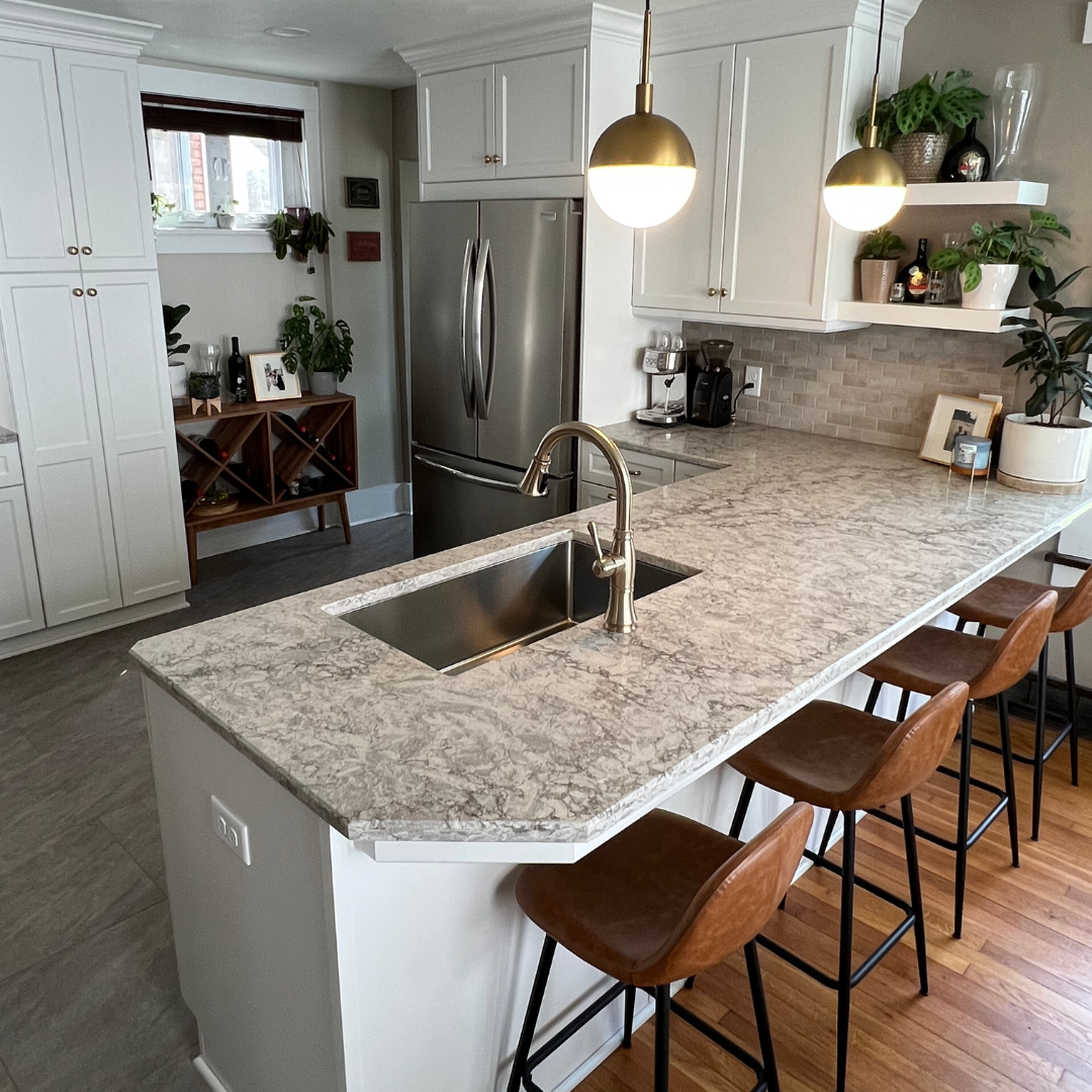 Classic kitchen remodel, marble countertop, white cabinet storage, leather height bar chairs