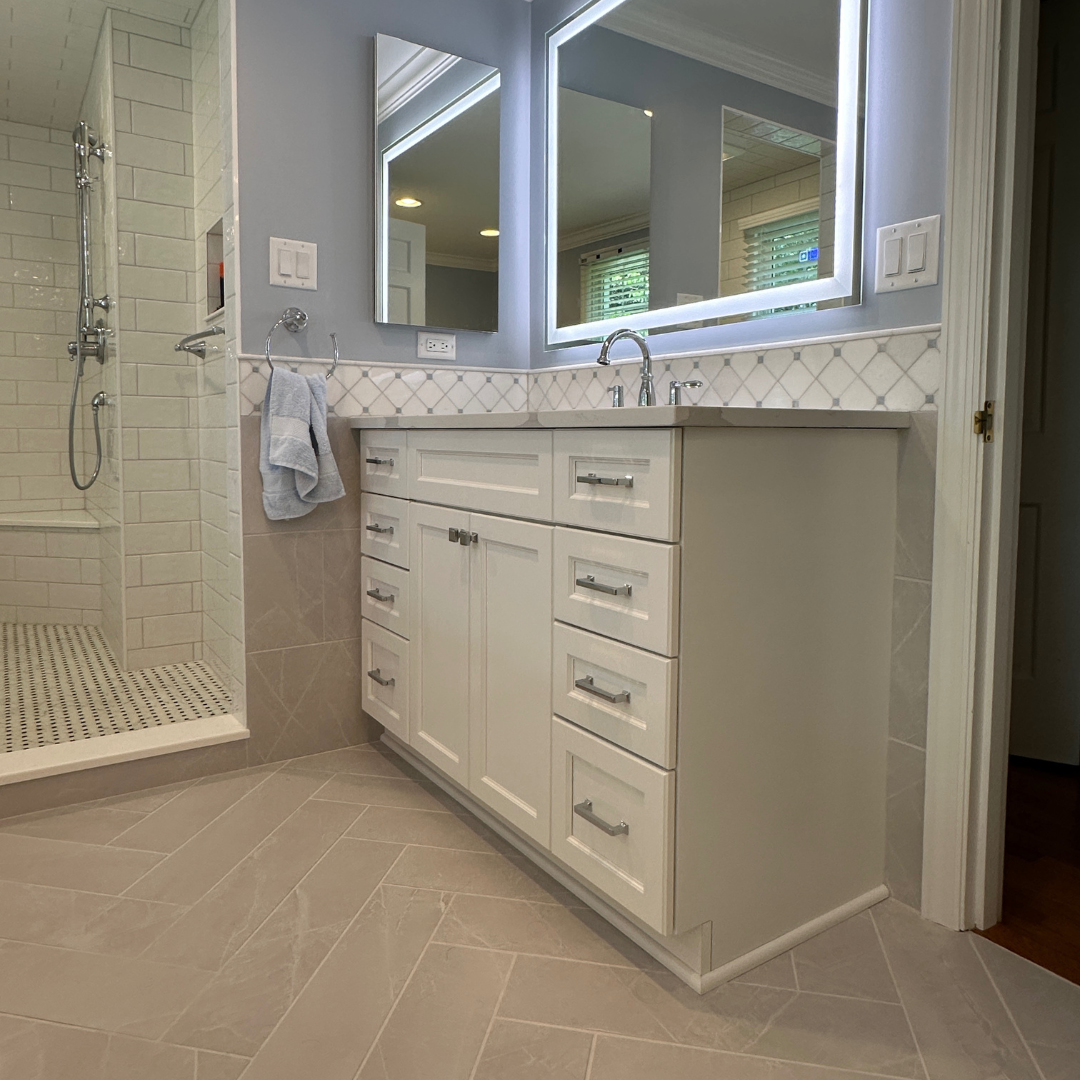 Classic small blue bathroom remodel with sink and open shower and black and white shower tiles, modern brown floor tiles