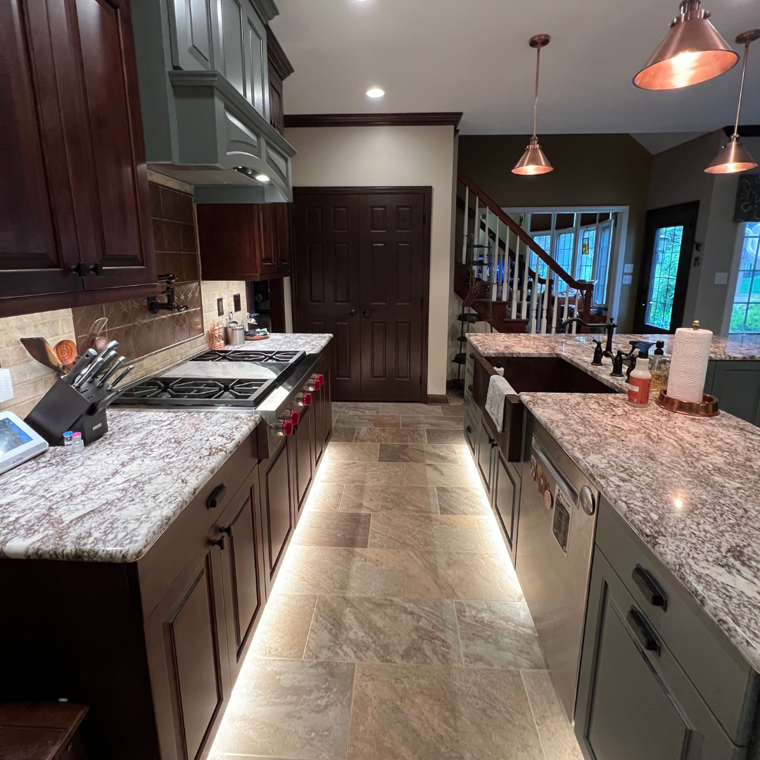 Traditional kitchen remodel with floor lightings, marble countertops, dark brown cabinet storage