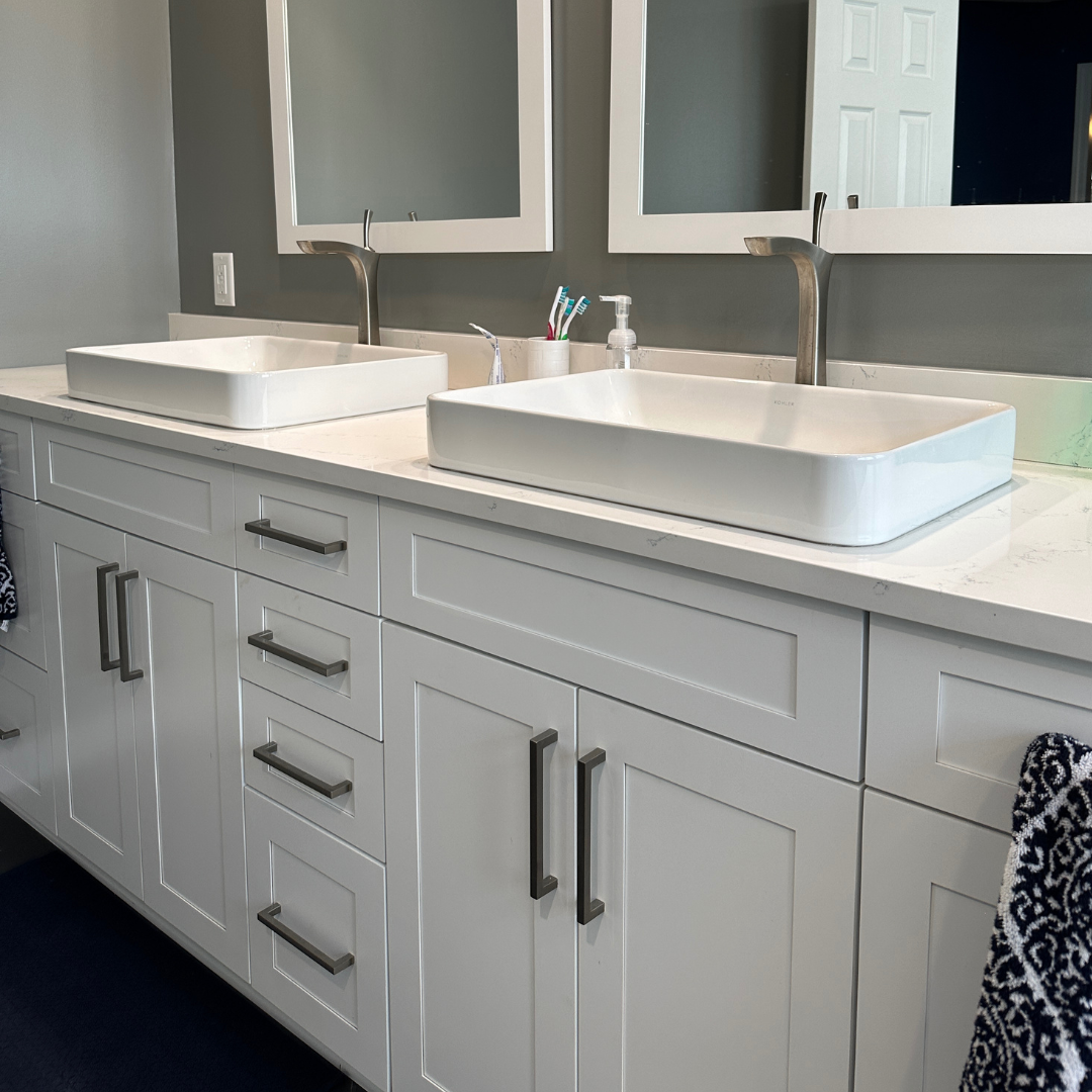 Contemporary white double sink with individual basins, white marble countertop, white cabinet storage