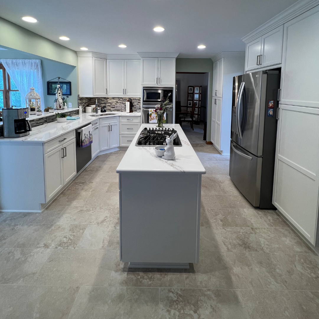 Modern kitchen remodel, central island with marble countertop, white closet storage, modern black and white backsplash