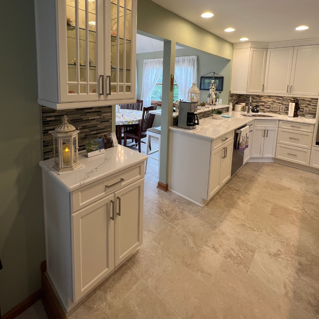 Modern kitchen remodel, marble countertops, white closet storage, classic floor tiles, tricolor backsplash