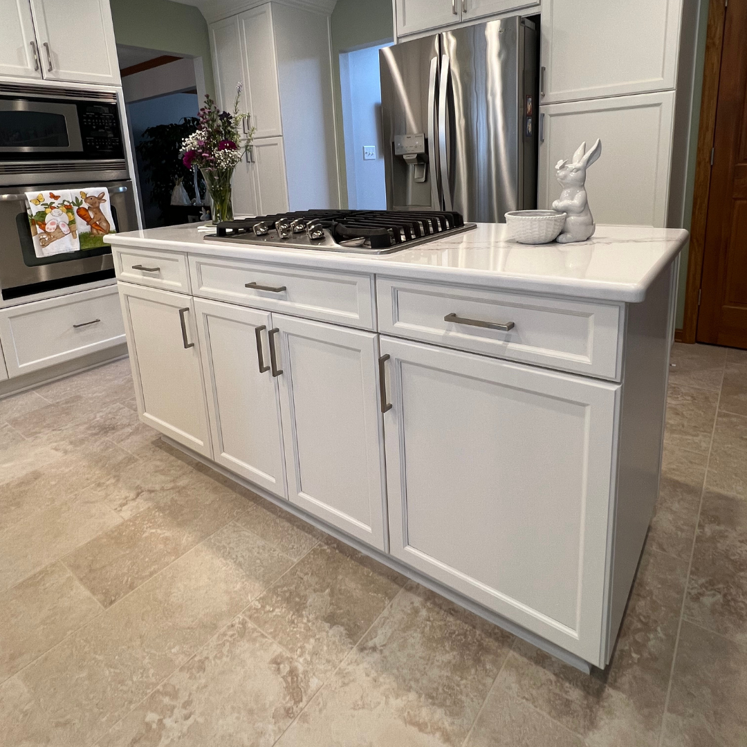 Modern kitchen remodel, central island with marble countertop, white closet storage, classic floor tiles