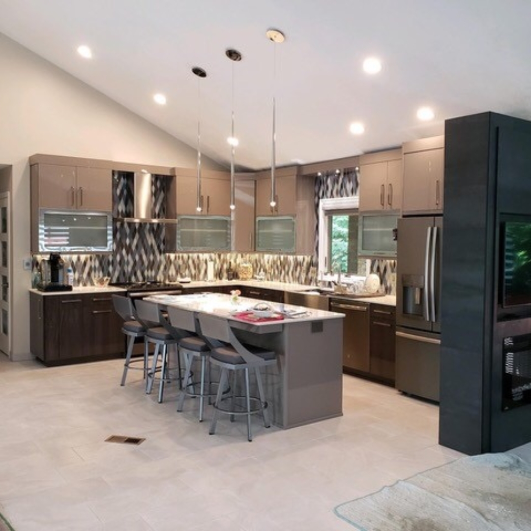 Modern brown kitchen, brown wall cabinets, center island / table, light brown floor tiles, black stove