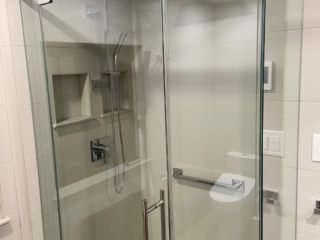 Rain shower head modern bathroom, walk-in shower, glass doors, pebble stone design, contemporary glass shower, spa-inspired shower remodel