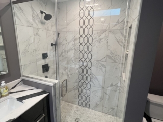 Marble shower idea, hexagonal tile accent, glass shower inspiration, black shower fixtures, luxury shower idea
