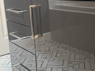 Glossy vanity idea, modern drawer handles, seek bathroom cabinet, contemporary vanity inspiration, elegant bathroom detail