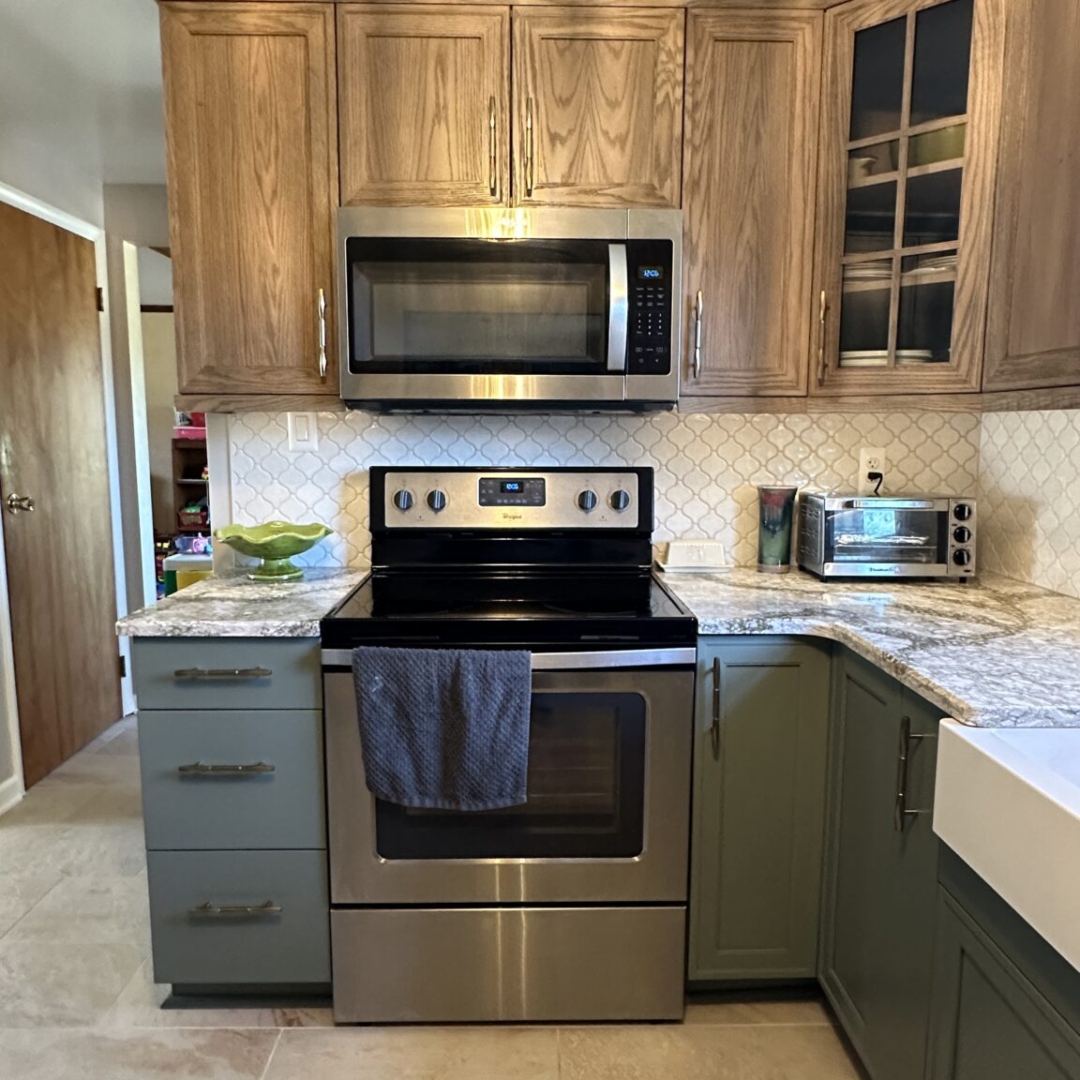Modern kitchen remodel, dark green base cabinets, brown wall cabinets, grey and white countertop, beige rectangular floor tiles