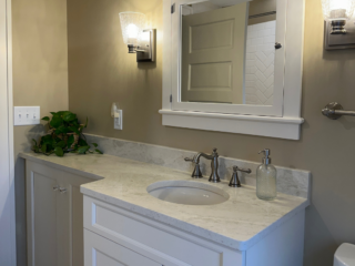 Traditional bathroom, white marble countertop single sink, top mirror cabinet, bottom white cabinet