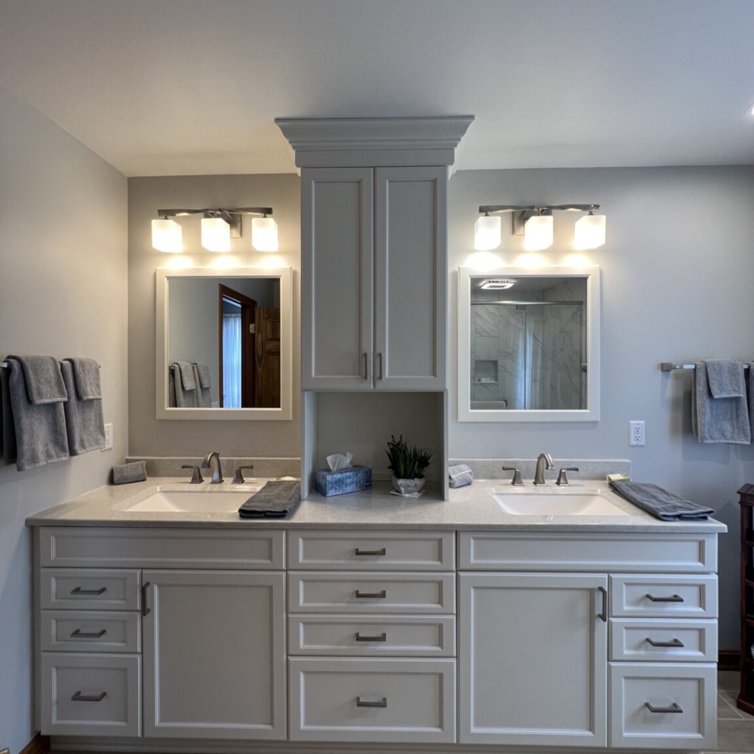 Modern bathroom, separated double sink, white marble countertop sink, large white cabinet storage, two mirrors