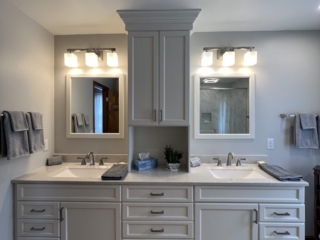 Modern bathroom, separated double sink, white marble countertop sink, large white cabinet storage, two mirrors